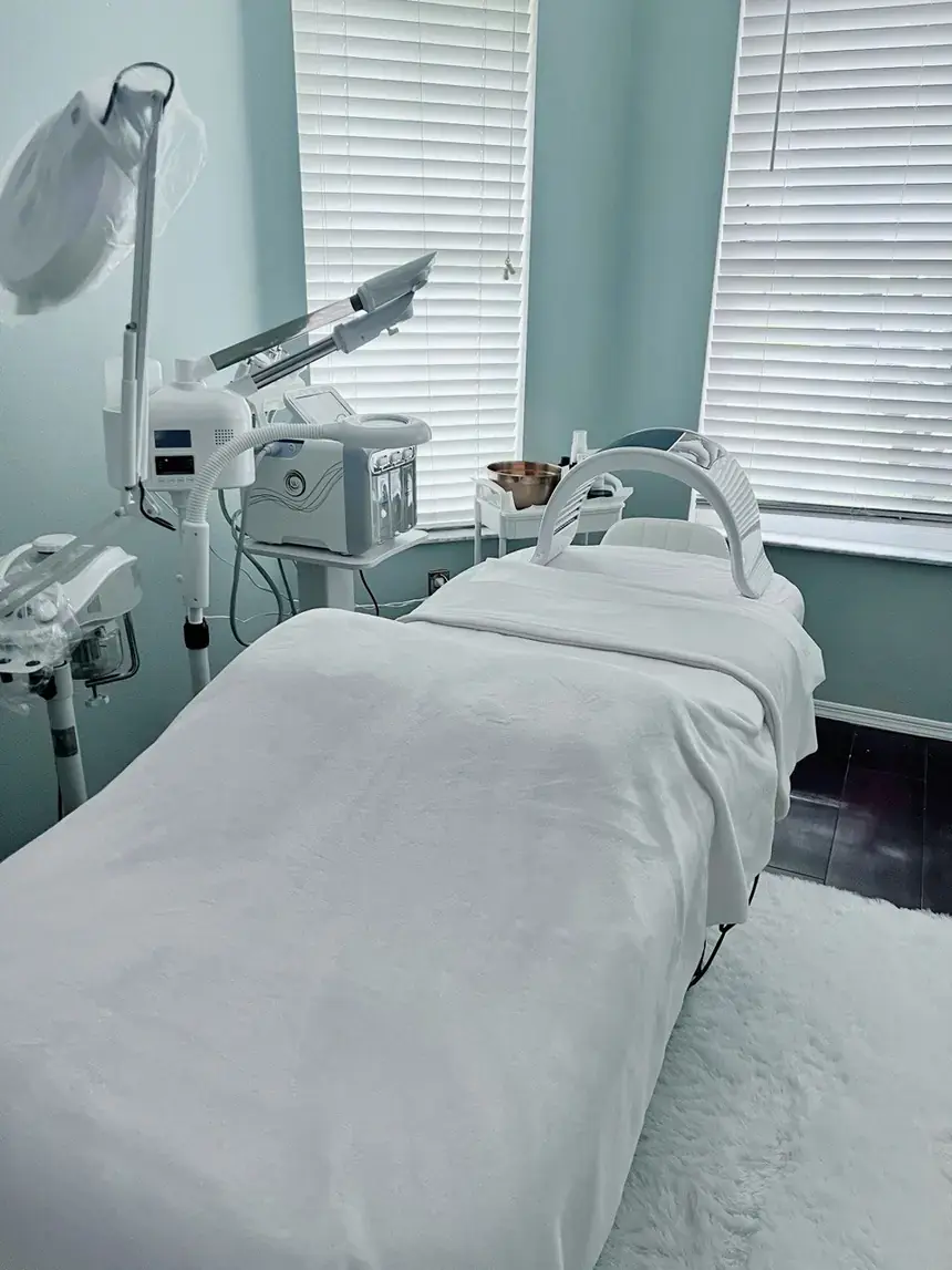 Treatment bed and LED therapy equipment at Nova Vita Esthetics
